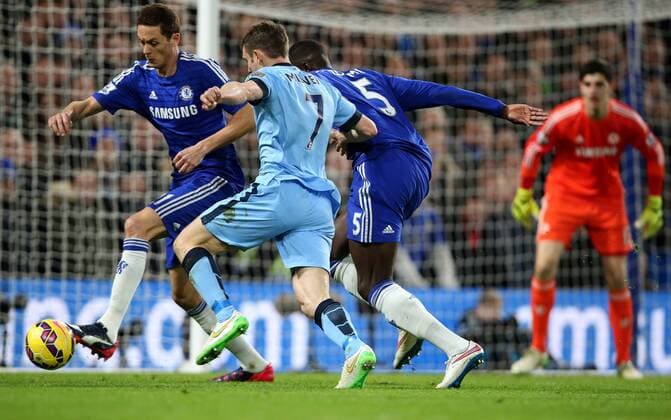 (150201) -- LONDON, Jan. 31, 2015 -- James Milner (2nd L) of Manchester City breaks through the defence of Nemanja Matic (1st L) and Kurt Zouma (2nd R) of Chelsea during the Barclays Premier League match between Chelsea and Manchester City at Stamford Bridge in London, England on January 31, 2015. The match ended in 1-1 draw. ) FOR EDITORIAL USE ONLY. NOT FOR SALE FOR MARKETING OR ADVERTISING CAMPAIGNS. NO USE WITH UNAUTHORIZED AUDIO, VIDEO, DATA, FIXTURE LISTS, CLUB LEAGUE LOGOS OR LIVE SERVICES. ONLINE IN-MATCH USE LIMITED TO 45 IMAGES, NO VIDEO EMULATION. NO USE IN BETTING, GAMES OR SINGLE CLUB LEAGUE PLAYER PUBLICATIONS. (SP)UK-LONDON-SOCCER-BARCLAYS PREMIER LEAGUE-CHELSEA VS MANCHESTER CITY HanxYan