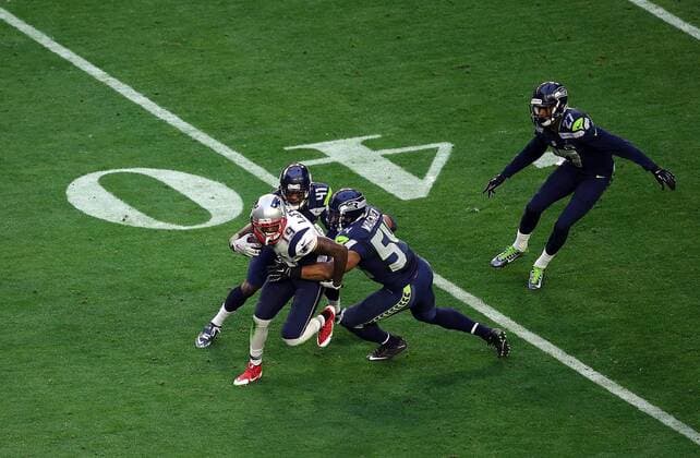 01 February 2015: New England Patriots wide receiver Brandon LaFell 19 is hit by Seattle Seahawks cornerback Byron Maxwell 41 (back) and middle linebacker Bobby Wagner 54 (right) during the first half of Super Bowl XLIX between the Seattle Seahawks and the New England Patriots at University of Phoenix Stadium in Glendale, Az. NFL American Football Herren USA FEB 01 Super Bowl XLIX - Patriots v Seahawks Icon3171502011321 EDITORIAL USE ONLY