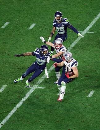 01 February 2015: New England Patriots wide receiver Julian Edelman 11 is tackled by Seattle Seahawks cornerback Tharold Simon 27 during the second half of Super Bowl XLIX between the Seattle Seahawks and the New England Patriots at University of Phoenix Stadium in Glendale, Az. The New England Patriots beat the Seattle Seahawks 28-24. NFL American Football Herren USA FEB 01 Super Bowl XLIX - Patriots v Seahawks Icon3171502012685 EDITORIAL USE ONLY