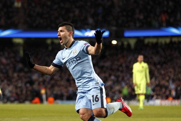 Sergio Kun Aguero of Manchester City celebrates after scoring during the UEFA Champions league Round of 16 first leg match between Manchester City and Barcelona at Etihad Stadium in Manchester, Britain, on Feb. 24, 2015. Barcelona won 2-1. ) (SP)BRITAIN-MANCHESTER-FOOTBALL-CHAMPIONS LEAGUE-ROUND OF 16 1ST LEG-MANCHESTER CITY VS BARCELONA HanxYan