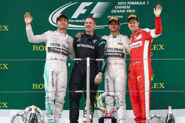 Germany s Nico Rosberg, left, and Britain s Lewis Hamilton, second right, of Mercedes, Germany s Sebastian Vettel of Ferrari, right, pose during the award ceremony of the 2015 Formula 1 Chinese Grand Prix at the Shanghai International Circuit in Shanghai, China, 12 April 2015. Lewis Hamilton put Mercedes back on top in Formula One, leading for most of the race on Sunday (12 April 2015) to capture his fourth Chinese Grand Prix victory. Hamilton made sure there would be no repeat of Ferrari s surprising win two weeks ago at the Malaysian Grand Prix, conserving his tires to withstand a challenge by the Italian team s Sebastian Vettel and easily capture the 35th win of his career. Hamilton s Mercedes teammate Nico Rosberg finished second and Vettel was third. Lewis Hamilton wins 4th Chinese Grand Prix pbu258197_04