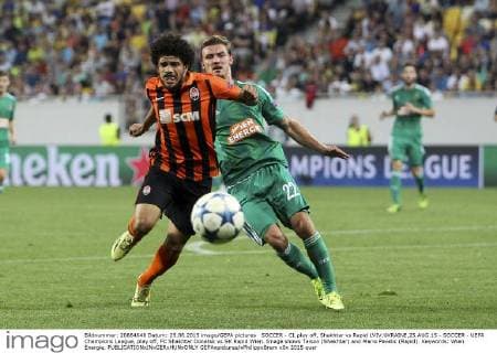 SOCCER - CL play off, Shakhtar vs Rapid LVIV,UKRAINE,25.AUG.15 - SOCCER - UEFA Champions League, play off, FC Shakhtar Donetsk vs SK Rapid Wien. Image shows Taison (Shakhtar) and Mario Pavelic (Rapid). Keywords: Wien Energie. GEPAxpictures xPhilippxBrem
