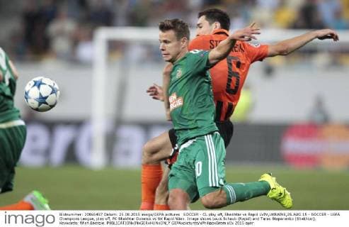SOCCER - CL play off, Shakhtar vs Rapid LVIV,UKRAINE,25.AUG.15 - SOCCER - UEFA Champions League, play off, FC Shakhtar Donetsk vs SK Rapid Wien. Image shows Louis Schaub (Rapid) and Taras Stepanenko (Shakhtar). Keywords: Wien Energie. GEPAxpictures xPhilippxBrem