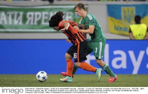SOCCER - CL play off, Shakhtar vs Rapid LVIV,UKRAINE,25.AUG.15 - SOCCER - UEFA Champions League, play off, FC Shakhtar Donetsk vs SK Rapid Wien. Image shows Marcio Azevedo (Shakhtar) and Philipp Schobesberger (Rapid). Keywords: Wien Energie. GEPAxpictures xPhilippxBrem