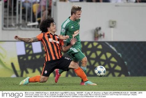 SOCCER - CL play off, Shakhtar vs Rapid LVIV,UKRAINE,25.AUG.15 - SOCCER - UEFA Champions League, play off, FC Shakhtar Donetsk vs SK Rapid Wien. Image shows Marcio Azevedo (Shakhtar) and Philipp Schobesberger (Rapid). Keywords: Wien Energie. GEPAxpictures xPhilippxBrem