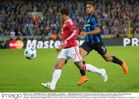 - BRUGGE, BELGIUM: Manchester s Memphis Depay and Club s Jean-Charles Castelletto fight for the ball during a soccer game between Belgian first league team Club Brugge KV and British club Manchester United ManU FC in Brugge, Wednesday 26 August 2015, the return game of the play-offs of the UEFA Champions League competition. Manchester United won the first leg 3-1. KURTxDESPLENTER x04687487x