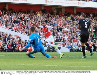 Arsenal s Theo Walcott scoring his sides opening goal Barclays Premier League- Arsenal vs Stoke City - Emirates Stadium - England - 12th September 2015 - Picture David Klein Sportimage EDITORIAL USE ONLY. No use with unauthorised audio, video, data, fixture lists, club league logos or live services. Online in-match use limited to 120 images, no video emulation. No use in betting, games or single club league player publications.