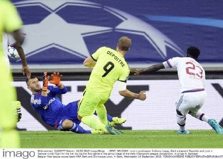 - GENT, BELGIUM: Lyon s goalkeeper Anthony Lopes, Gent s Laurent Depoitre and Lyon s Samuel Umtiti fight for the ball during the first game in the group stage of the Uefa Champions League competition, in group H, between Belgian first league soccer team KAA Gent and Olympique Lyon, in Gent, Wednesday 16 September 2015. YORICKxJANSENS x04701463x