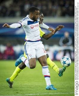 - GENT, BELGIUM: Lyon s Alexandre Lacazette and Gent s Nana Asare fight for the ball during the first game in the group stage of the Uefa Champions League competition, in group H, between Belgian first league soccer team KAA Gent and Olympique Lyon, in Gent, Wednesday 16 September 2015. JASPERxJACOBS x04701667x