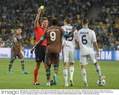 Sept. 16, 2015 - Kiev, Ukraine - Referee Felix Brych shows a yellow card during the UEFA Champions League Group G stage football match between FC Dynamo Kyiv and FC Porto at NSK Olimpiyskyi Stadium in Kyiv on September 16, 2015. Champions League: FC Dynamo Kyiv vs FC Porto - ZUMAn230