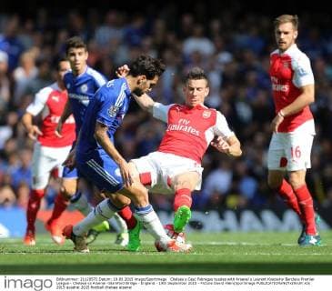 Chelsea s Cesc Fabregas tussles with Arsenal s Laurent Koscielny Barclays Premier League - Chelsea vs Arsenal -Stamford Bridge - England - 19th September 2015 - Picture David Klein Sportimage EDITORIAL USE ONLY. No use with unauthorised audio, video, data, fixture lists, club league logos or live services. Online in-match use limited to 120 images, no video emulation. No use in betting, games or single club league player publications.