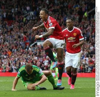 Memphis Depay of Manchester United ManU celebrates scoring the opening goal - Manchester United vs. Sunderland - Barclay s Premier League - Old Trafford - Manchester - 26 09 2015 Pic Philip Oldham SportImage EDITORIAL USE ONLY. No use with unauthorised audio, video, data, fixture lists, club league logos or live services. Online in-match use limited to 120 images, no video emulation. No use in betting, games or single club league player publications.