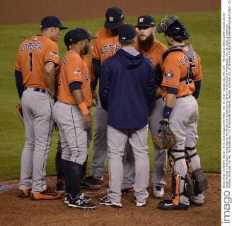 Oct. 14, 2015 - Kansas City, MO, USA - The Houston Astros gather around pitcher Dallas Keuchel in the eighth inning against the Kansas City Royals during Game 5 of the ALDS on Wednesday, Oct. 14, 2015, at Kauffman Stadium in Kansas City, Mo. The Royals won, 7-2, to eliminate the Astros. Houston at Kansas City, ALDS Game 5 - ZUMAm67_