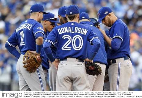 Oct. 17, 2015 - Kansas City, MO, USA - Toronto Blue Jays starting pitcher David Price, right, confers with teammates on the mound in the seventh inning against the Kansas City Royals in Game 2 of the ALCS on at Kauffman Stadium in Kansas City, Mo., on Saturday, Oct. 17, 2015. Toronto at Kansas City, ALCS Game 2 - ZUMAm67_