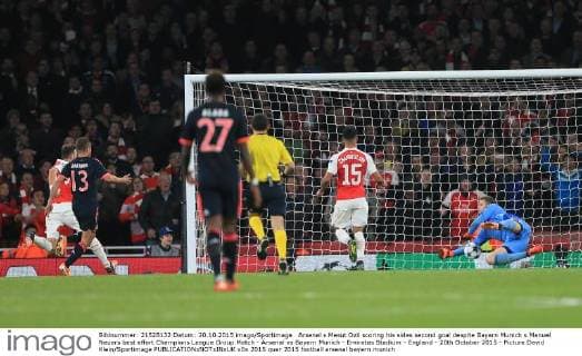 Arsenal s Mesut Ozil scoring his sides second goal despite Bayern Munich s Manuel Neuers best effort Champions League Group Match - Arsenal vs Bayern Munich - Emirates Stadium - England - 20th October 2015 - Picture David Klein Sportimage EDITORIAL USE ONLY. No use with unauthorised audio, video, data, fixture lists, club league logos or live services. Online in-match use limited to 120 images, no video emulation. No use in betting, games or single club league player publications.