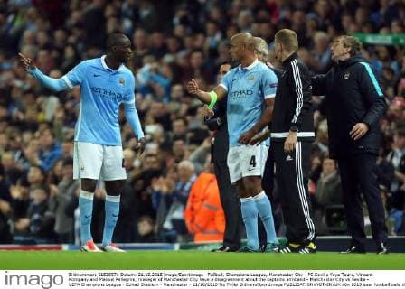 Fußball, Champions League, Manchester City - FC Sevilla Yaya Toure, Vincent Kompany and Manuel Pellegrini, manager of Manchester City have a disagreement about the captains armband - Manchester City vs Sevilla - UEFA Champions League - Etihad Stadium - Manchester - 21 10 2015 Pic Philip Oldham SportImage EDITORIAL USE ONLY. No use with unauthorised audio, video, data, fixture lists, club league logos or live services. Online in-match use limited to 120 images, no video emulation. No use in betting, games or single club league player publications.
