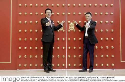 Jack Ma Yun, right, Chairman of Alibaba Group, and Xu Jiayin (Hui Ka Yan), Chairman of Evergrande Group, pose at the listing ceremony for shares of Guangzhou Evergrande Taobao Football Club in Beijing, China, 6 November 2015. China s real estate giant Guangzhou Evergrande and e-commerce giant Alibaba Group listed their soccer club Evergrande Taobao, former Asian Champions League winners, on Friday (6 November 2015) in what is a first for a football team in the region. Launched on the system National Equities Exchange and Quotations , the club was listed on China s so-called New Third Board for small enterprises. The listing of Evergrande Taobao will further strengthen its corporate governance structure and enhance the liquidity of its equity interest, thus facilitating the introduction of strategic investors, promotion of corporate image and realization of sustainable development,¡± Evergrande said earlier. Alibaba paid US$192 million for a stake in the club in 2014 while Guangzhou Evergrande owns 60 percent of the club. Evergrande, Alibaba list joint football club to become first in Asia 20151106_32303