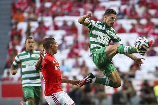 Aug. 31, 2014 - Lisbon, Portugal - Sporting«s midfielder Adrien Silva (R) vies with Benfica s defender Maxi Pereira during the Portuguese Liga football match SL Benfica vs Sporting CP at Luz stadium in Lisbon on August 31, 2014. NURPHOTO CARLOS COSTA FBL-LIGA-SPORTING-BENFICA - ZUMAn230