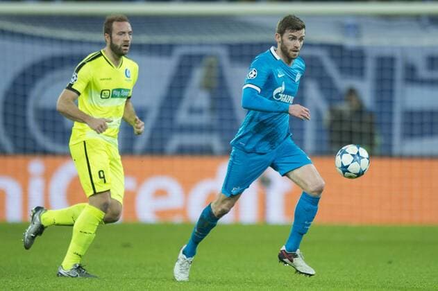 - GENT, BELGIUM: Gent s Laurent Depoitre and Zenit s Nicolas Lombaerts fight for the ball during a soccer game between Belgian team KAA Gent and Russian club FC Zenit Saint Petersburg, Wednesday 09 December 2015, in Gent, the sixth and last day of the group stage the UEFA Champions League competition, in group H. JASPERxJACOBS x04754654x