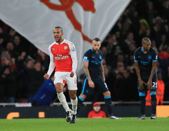 Arsenal s Theo Walcott celebrates scoring his sides opening goal Barclays Premier League- Arsenal vs Manchester City - Emirates Stadium - England - 21st December 2015 - Picture David Klein Sportimage EDITORIAL USE ONLY. No use with unauthorised audio, video, data, fixture lists, club league logos or live services. Online in-match use limited to 120 images, no video emulation. No use in betting, games or single club league player publications.