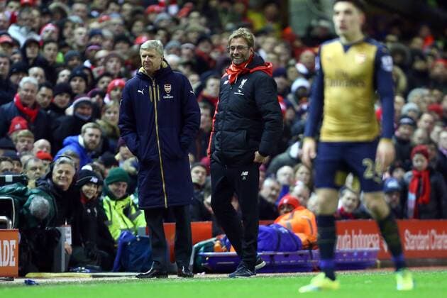 Arsenal s manager, Arsene Wenger and Manager of Liverpool, Jurgen Klopp watch on - Barclay s Premier League - Liverpool vs Arsenal - Anfield - Liverpool - 13 01 2016 Pic Philip Oldham SportImage EDITORIAL USE ONLY. No use with unauthorised audio, video, data, fixture lists, club league logos or live services. Online in-match use limited to 120 images, no video emulation. No use in betting, games or single club league player publications.