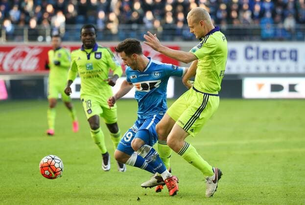 - GENT, BELGIUM: Gent s Brecht Dejaegere and Anderlecht s Olivier Deschacht fight for the ball during the Jupiler Pro League match between KAA Gent and RSC Anderlecht, in Gent, Sunday 17 January 2016, on day 22 of the Belgian soccer championship. VIRGINIExLEFOUR x04775324x