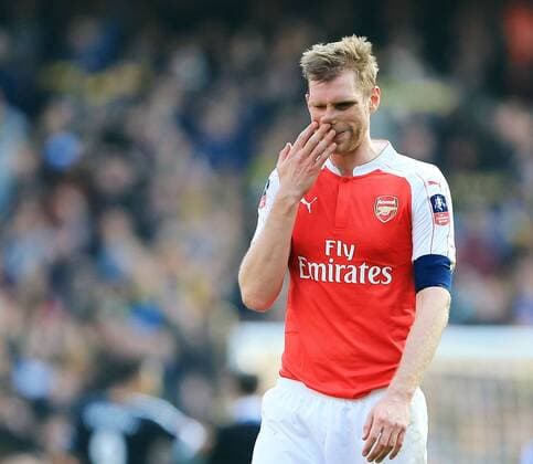 Arsenal s Per Mertesacker looks on dejected at the final whistle during the Emirates FA Cup match at The Emirates Stadium. Photo credit should read: David Klein Sportimage EDITORIAL USE ONLY. No use with unauthorised audio, video, data, fixture lists, club league logos or live services. Online in-match use limited to 120 images, no video emulation. No use in betting, games or single club league player publications.