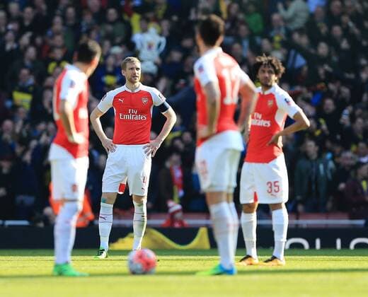 Arsenal s Per Mertesacker looks on dejected after going 2-0 down during the Emirates FA Cup match at The Emirates Stadium. Photo credit should read: David Klein Sportimage EDITORIAL USE ONLY. No use with unauthorised audio, video, data, fixture lists, club league logos or live services. Online in-match use limited to 120 images, no video emulation. No use in betting, games or single club league player publications.