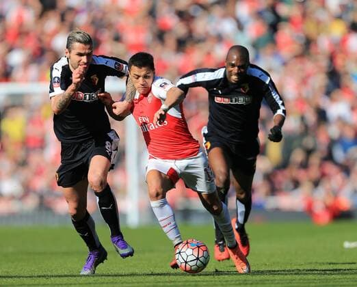 Arsenal s Alexis Sanchez tussles with Watford s Valon Behrami during the Emirates FA Cup match at The Emirates Stadium. Photo credit should read: David Klein Sportimage EDITORIAL USE ONLY. No use with unauthorised audio, video, data, fixture lists, club league logos or live services. Online in-match use limited to 120 images, no video emulation. No use in betting, games or single club league player publications.