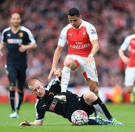 Arsenal s Alexis Sanchez tussles with Watford s Ben Watson during the Premier League match at Emirates Stadium. Photo credit should read: David Klein Sportimage EDITORIAL USE ONLY. No use with unauthorised audio, video, data, fixture lists, club league logos or live services. Online in-match use limited to 120 images, no video emulation. No use in betting, games or single club league player publications.