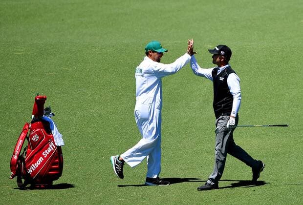April 9, 2016 - Augusta, GA, USA - Kevin Streelman, right, high-fives caddie, A.J. Montecinos after making eagle on the 2nd hole during the third round of the 80th Masters at the Augusta National Golf Club in Augusta, Ga., on Saturday, April 9, 2016. Masters, third round - ZUMAm67_