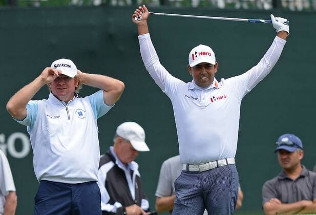 May 5, 2016 - Charlotte, NC, USA - Anirban Lahiri, right, stretches before teeing off from the 17th tee box as William McGirt, left, looks on during first round action of the Wells Fargo Championship on Thursday, May 5, 2016 at Quail Hollow Club in Charlotte, N.C. Lahiri finished the round at -6 and McGirt finished at -2. Wells Fargo Championship - ZUMAm67_
