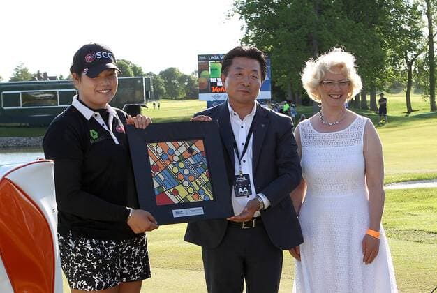 May 29, 2016 - Ann Arbor, Michigan, United States - Ariya Jutanugarn of Bangkok, and Kyung Ahn moon, Chairman of Volvik INC and Nawal Matowi, artist, pose for a photo after winning the final round of the inaugural LPGA Golf Damen Volvik Championship at Travis Pointe Country Club in Ann Arbor, MI, USA Sunday, May 29, 2016. LPGA Volvik Championship - Final Round - ZUMAn230
