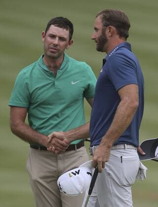 July 3, 2016 - Akron, OH, USA - Winner Dustin Johnson, right, shakes hands with Charl Schwartzel, who finished tied for seventh, on the 18th hole on the final day of the Bridgestone Invitational golf tournament on Sunday, July 3, 2016, at Firestone Country Club in Akron, Ohio. Bridgestone Invitational - ZUMAm67_