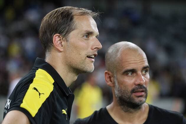 Head coach Pep Guardiola of Manchester City, right, talks to head coach Thomas Tuchel of Borussia Dortmund before the penalty shootout of the Shenzhen match of the 2016 International Champions Cup China in Shenzhen city, south China s Guangdong province, 28 July 2016. Pep Guardiola got his first taste of victory as Manchester City s manager Thursday (28 July 2016) night after beating Borussia Dortmund on penalties in a friendly, but expressed concern about the looming English Premier League season. Football today is tough, said Guardiola, whose side beat their German opposition in the southern Chinese city of Shenzhen. City won, and finally got the workout Guardiola had craved, thanks to a 6-5 penalty shootout win over Dortmund, after the game ended one apiece. City keeper Angus Gunn was the hero of penalties with three saves, including the one sealing their victory when he palmed away Mikel Merino s attempt. Manchester City beat Dortmund on penalties in Shenzhen 20160728_65261
