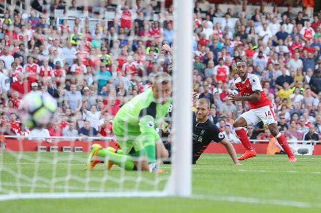 Arsenal s Theo Walcott scoring his sides opening goal during the Premier League match at the Emirates Stadium, London. Picture date August 14th, 2016 Pic David Klein Sportimage EDITORIAL USE ONLY. No use with unauthorised audio, video, data, fixture lists, club league logos or live services. Online in-match use limited to 120 images, no video emulation. No use in betting, games or single club league player publications.