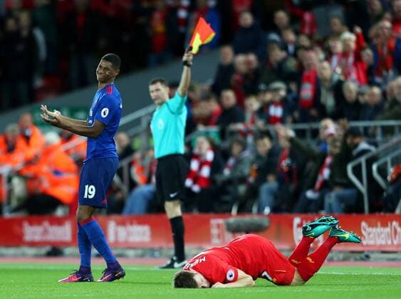 Wayne Rooney of Manchester United ManU reacts after fouling James Milner of Liverpool during the Premier League match at Anfield Stadium, Liverpool. Picture date: October 17th, 2016. Pic Matt McNulty Sportimage EDITORIAL USE ONLY. No use with unauthorised audio, video, data, fixture lists, club league logos or live services. Online in-match use limited to 120 images, no video emulation. No use in betting, games or single club league player publications.