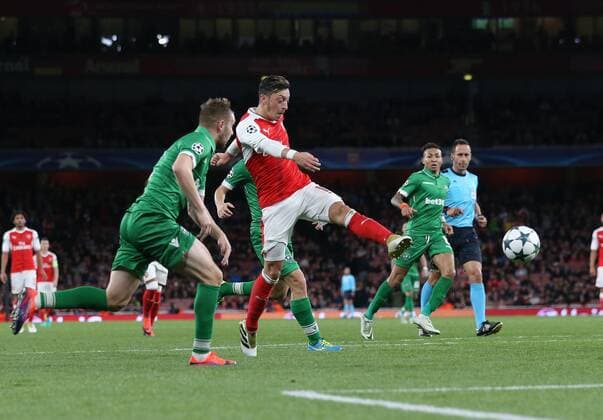 Arsenal s Mesut Ozil scoring his sides sixth goal during the Champions League group A match at the Emirates Stadium, London. Picture date October 19th, 2016 Pic David Klein Sportimage EDITORIAL USE ONLY. No use with unauthorised audio, video, data, fixture lists, club league logos or live services. Online in-match use limited to 120 images, no video emulation. No use in betting, games or single club league player publications.