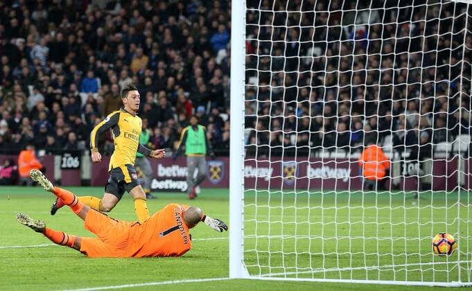 Arsenal s Mesut Ozil scoring his sides opening goal during the Premier League match at the London Stadium, London. Picture date December 3rd, 2016 Pic David Klein Sportimage EDITORIAL USE ONLY. No use with unauthorised audio, video, data, fixture lists, club league logos or live services. Online in-match use limited to 120 images, no video emulation. No use in betting, games or single club league player publications.