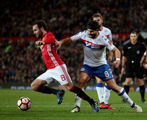 Juan Mata of Manchester United ManU in action with Sam Morsy of Wigan Athletic during the English FA Cup fourth round match at Old Trafford Stadium, Manchester. Picture date: January 29th, 2017. Pic Simon Bellis Sportimage EDITORIAL USE ONLY. No use with unauthorised audio, video, data, fixture lists, club league logos or live services. Online in-match use limited to 120 images, no video emulation. No use in betting, games or single club league player publications.