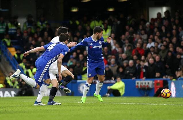 Chelsea s Cesc Fabregas scoring his sides opening goal during the Premier League match at the Stamford Bridge Stadium, London. Picture date February 25th, 2017 Pic David Klein Sportimage EDITORIAL USE ONLY. No use with unauthorised audio, video, data, fixture lists, club league logos or live services. Online in-match use limited to 120 images, no video emulation. No use in betting, games or single club league player publications.