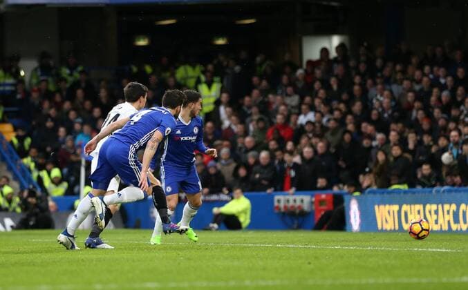 Chelsea s Cesc Fabregas scoring his sides opening goal during the Premier League match at the Stamford Bridge Stadium, London. Picture date February 25th, 2017 Pic David Klein Sportimage EDITORIAL USE ONLY. No use with unauthorised audio, video, data, fixture lists, club league logos or live services. Online in-match use limited to 120 images, no video emulation. No use in betting, games or single club league player publications.