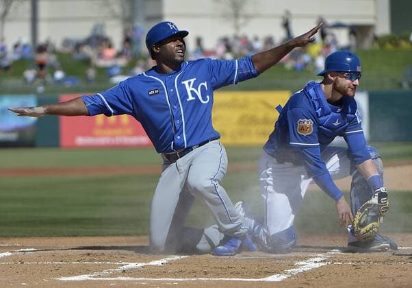 February 25, 2017 - Surprise, AZ, USA - The Kansas City Royals Lorenzo Cain, left, is tagged out at home plate by Texas Rangers catcher Jonathan Lucroy during the first inning in a spring training game in Surprise, Ariz., on Saturday, Feb. 25, 2017. The Royals won, 7-5. Texas Rangers spring training - ZUMAm67_ 20170225_zaf_m67_075 Copyright: xMaxxFaulknerx