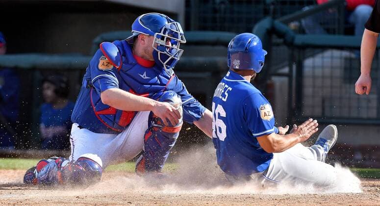 February 25, 2017 - Surprise, AZ, USA - The Kansas City Royals Ramo³n Torres is tagged out by Texas Rangers catcher Steven Lerud, left, in the ninth inning during a spring training game in Surprise, Ariz., on Saturday, Feb. 25, 2017. The Royals won, 7-5. Spring training: Kansas City at Texas - ZUMAm67_ 20170225_zaf_m67_105 Copyright: xJohnxSleezerx