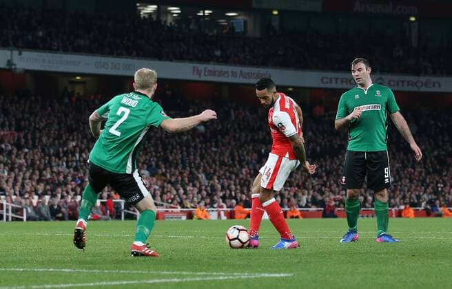 Arsenal s Theo Walcott scoring his sides opening goal during the FA Cup Quarter Final match at the Emirates Stadium, London. Picture date March 11th, 2017 Pic David Klein Sportimage EDITORIAL USE ONLY. No use with unauthorised audio, video, data, fixture lists, club league logos or live services. Online in-match use limited to 120 images, no video emulation. No use in betting, games or single club league player publications.