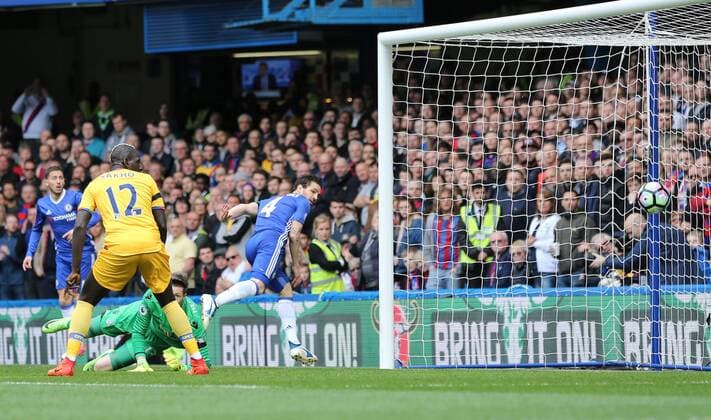 Chelsea s Cesc Fabregas scoring his sides opening goal during the Premier League match at the Stamford Bridge Stadium, London. Picture date: April 1st, 2017. Pic credit should read: David Klein Sportimage via PA Images EDITORIAL USE ONLY. No use with unauthorised audio, video, data, fixture lists, club league logos or live services. Online in-match use limited to 120 images, no video emulation. No use in betting, games or single club league player publications.