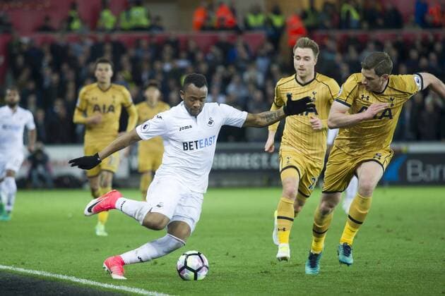 Football - 2016 2017 Premier League - Swansea City vs. Tottenham Hotspur Jordan Ayew of Swansea attacks, at The Liberty Stadium. COLORSPORT WINSTON BYNORTH
