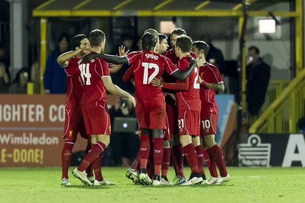 Steven Gerrard of Liverpool celebrates scoring his second goal with team mates during the The FA Cup match between AFC Wimbledon and Liverpool at the Cherry Red Records Stadium, Kingston, England on 5 January 2015. Copyright: xGarethxxBrownx 01320023
