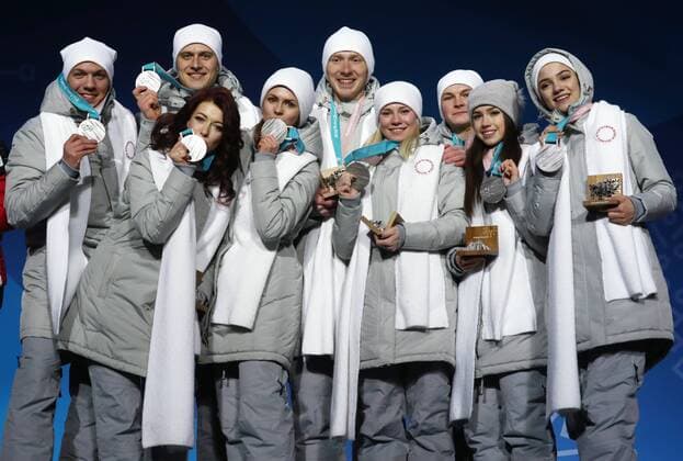 PYEONGCHANG, SOUTH KOREA – FEBRUARY 12, 2018: Olympic Athletes from Russia Dmitri Soloviev, Alexander Enbert, Ekaterina Bobrova, Natalya Zabiyako, Vladimri Morozov, Yevgenia Tarasova, Mikhail Kolyada, Alina Zagitova, and Evgenia Medvedeva, from left, pose with their silver medals during the victory ceremony for the Figure skating Eiskunstlauf team event at the 2018 Winter Olympic Games Olympische Spiele Olympia OS Valery Sharifulin TASS TS0737C1