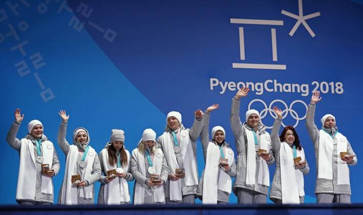 PYEONGCHANG, SOUTH KOREA – FEBRUARY 12, 2018: Olympic Athletes from Russia Mikhail Kolyada, Evgenia Medvedeva, Alina Zagitova, Yevgenia Tarasova, Vladimir Morozov, Natalya Zabiyako, Alexander Enbert, Ekaterina Bobrova, and Dmitri Soloviev (L-R) pose with their silver medals during the victory ceremony for the Figure skating Eiskunstlauf team event at the 2018 Winter Olympic Games Olympische Spiele Olympia OS Valery Sharifulin TASS TS0737CA